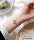 Hình ảnh: Lắc tay titan mặt tròn hoa trắng 570