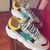 giay-the-thao-nu-giay-sneaker-mau-xanh-vang