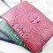 Clutch cầm tay da cá sấu